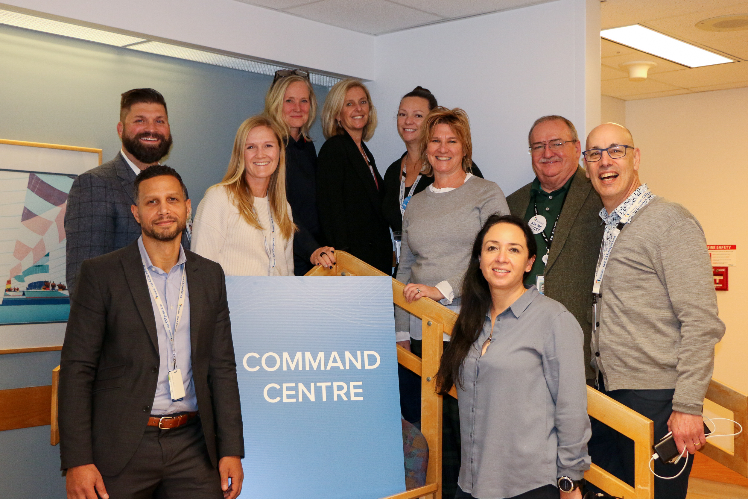 Group of VCH staff holding sign that says command centre.