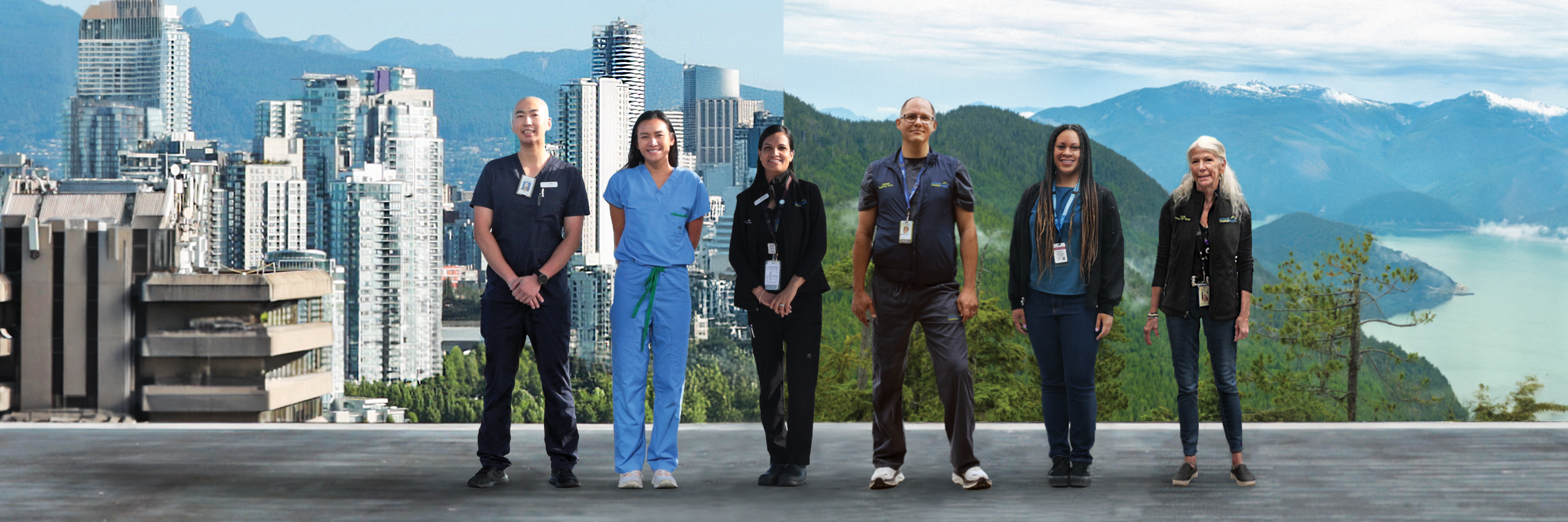 Staff standing against backdrop of city and mountains