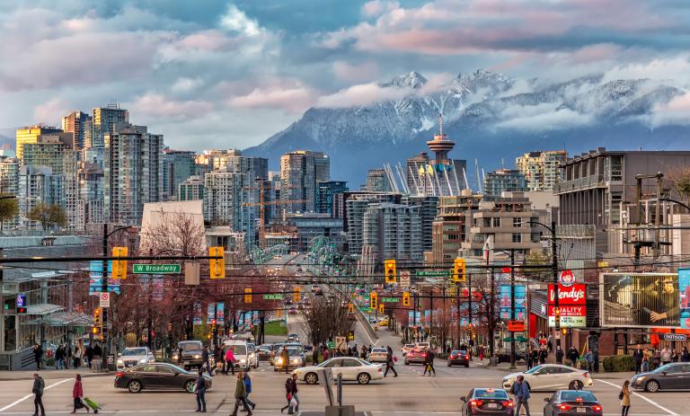 Vancouver downtown and a snowy mountain across the strait