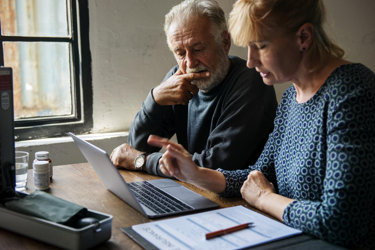 Elderly couple planning on health-care plan