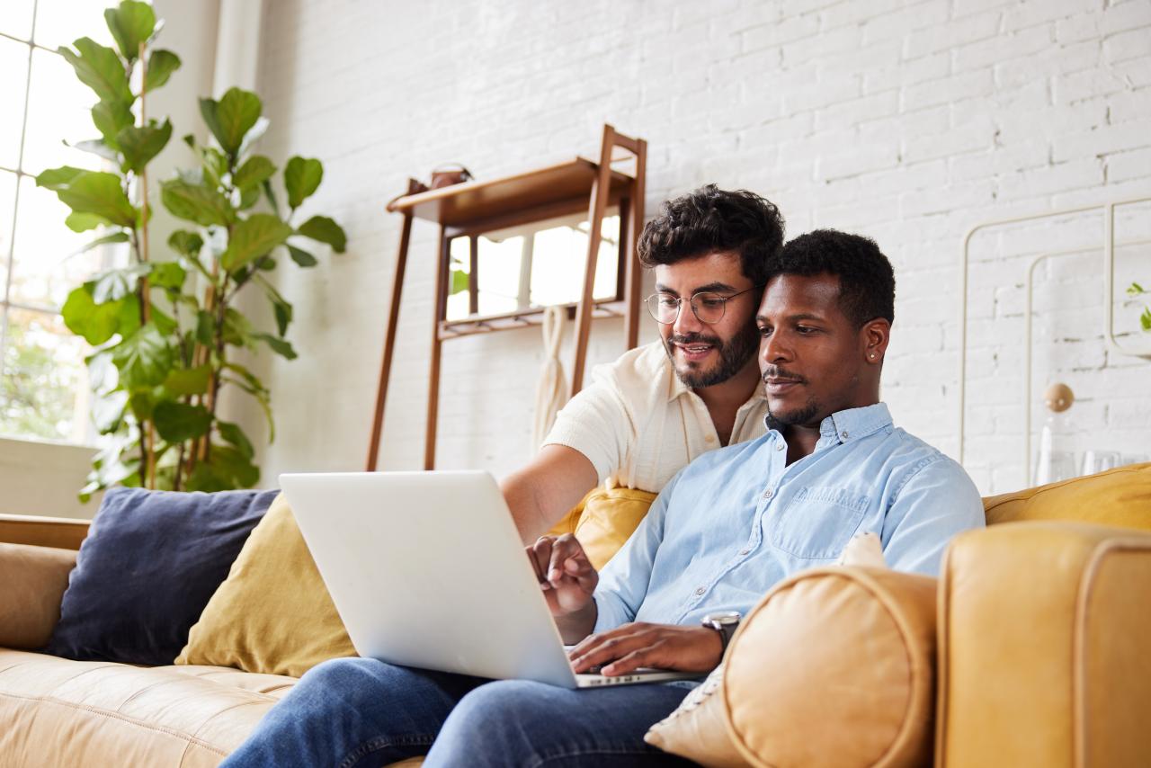 Couple looking at laptop together