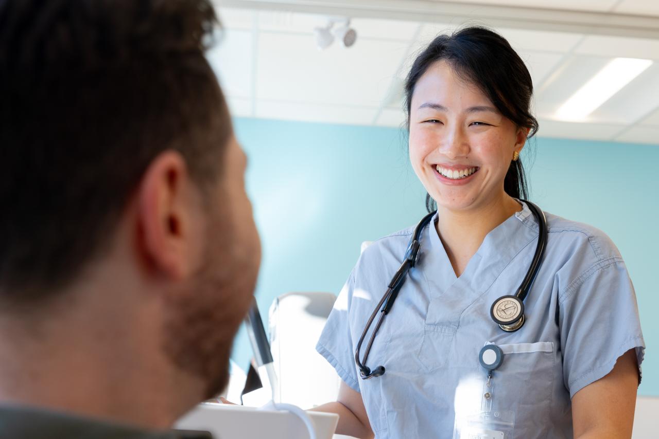 Physician talking with patient at a UPCC