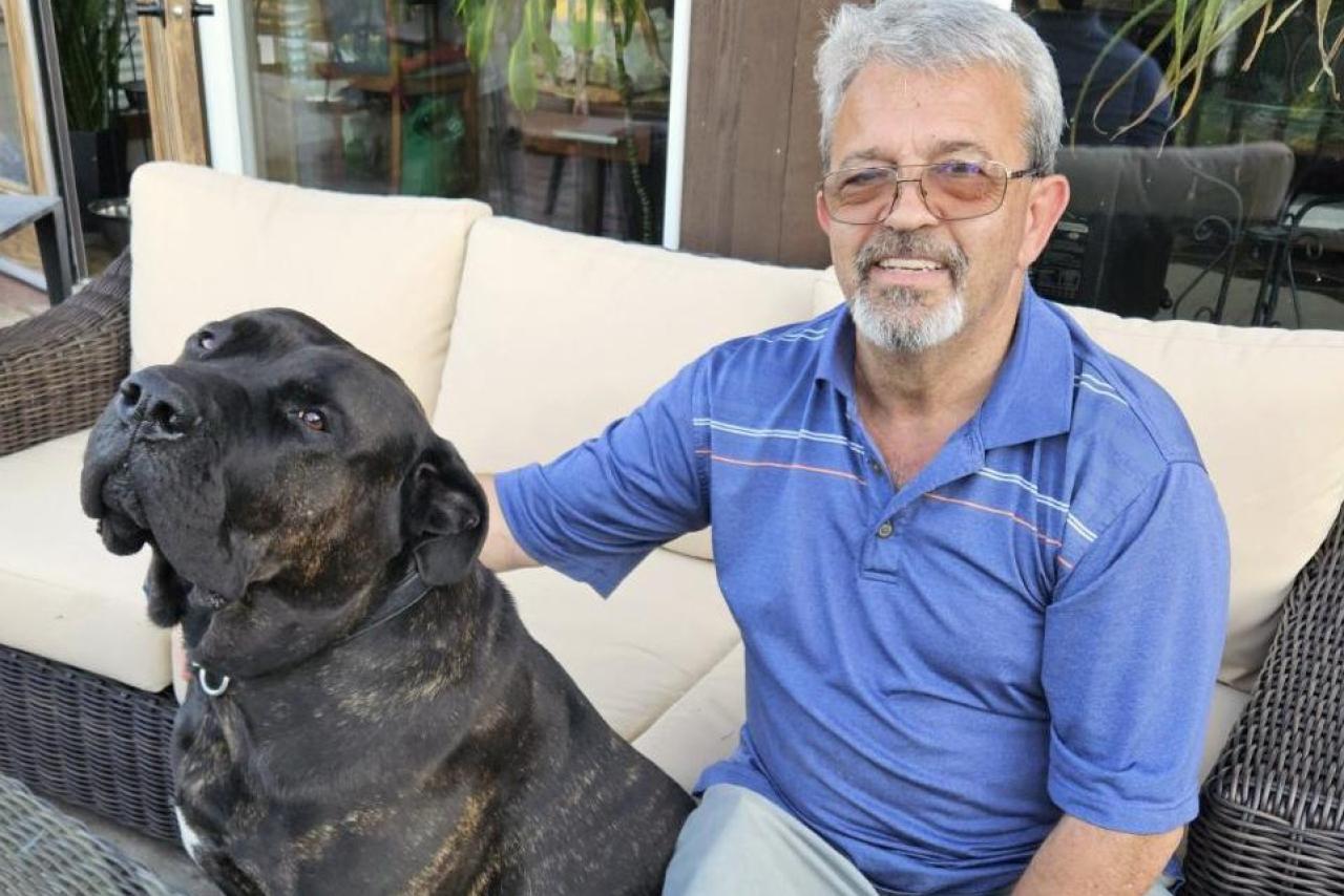Manny Chiquita with pet dog