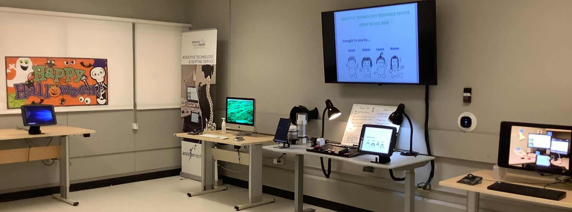 Interior of the Assistive Technology Resource Centre located in G.F. Strong Rehabilitation Centre. Various devices are visible on desks