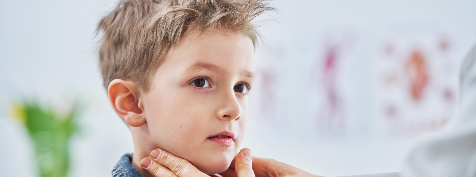 Boy having medical examination by paediatrician