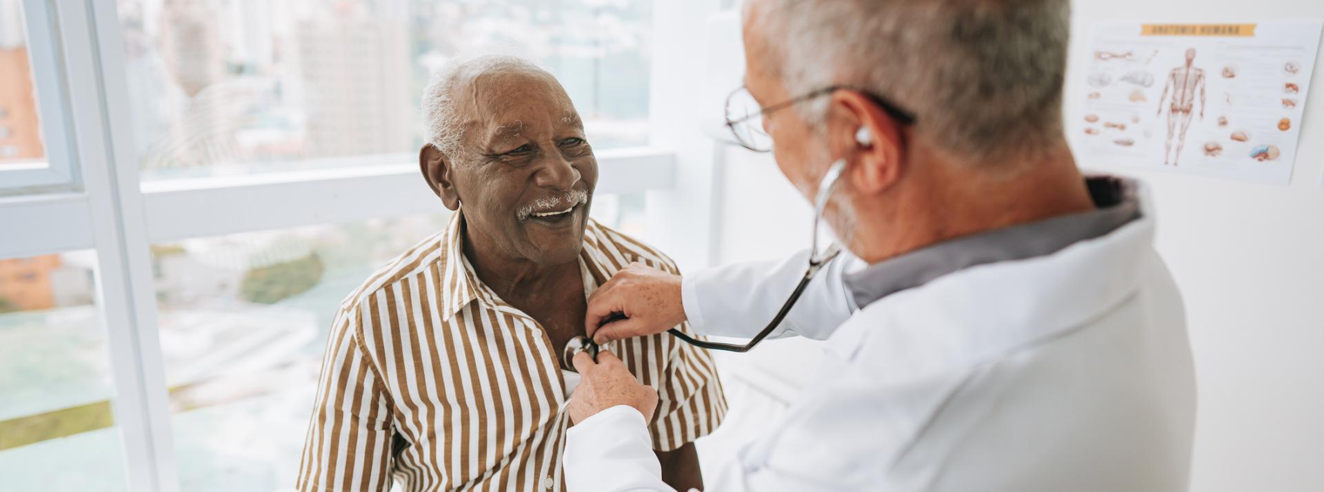 Portrait of a doctor listening to a patient's heartbeat