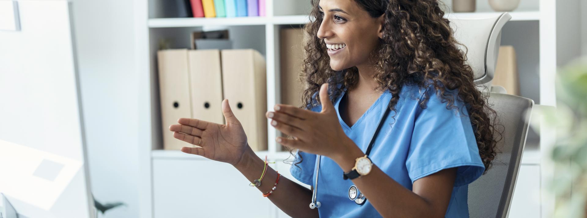 Female nurse explaining medical treatment to patient through a video call