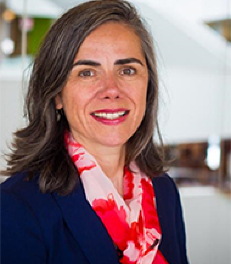 Portrait of Darlene MacKinnon in the lobby of a building