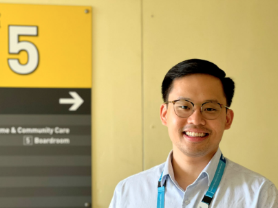 man in front of yellow sign