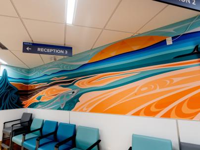 Mural on wall in medical building of a salmon and orca whale in the ocean