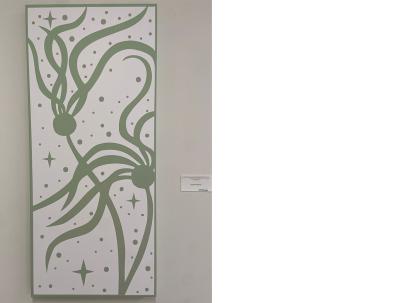 Indigenous canvas print on a wall in the colors of white and green