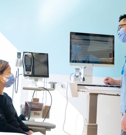 Physician speaking to a patient at Richmond East UPCC.